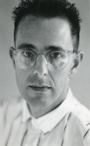 Handspan Theatre Peter Crosbie portrait of dark-haired man wearing glasses