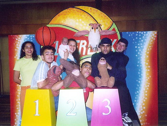 5 indigenous performers and one anglo-australian performer with puppets - an owl, baby and three penises