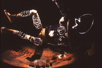 wire figure falls to floor of stage