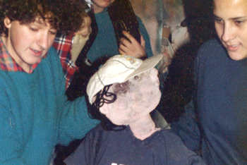 teenages with their life-size puppet cyclist sat on a real bicycle